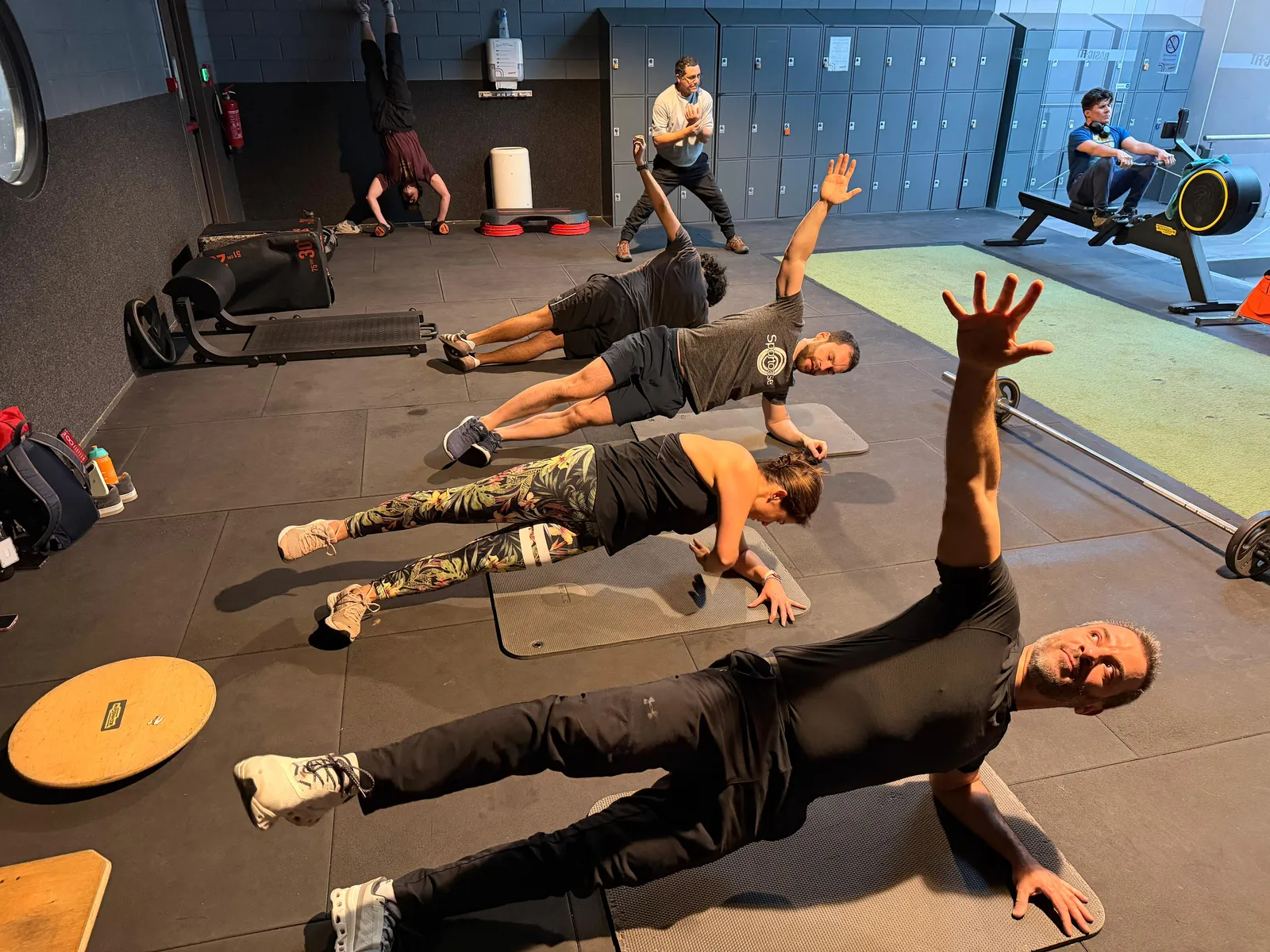 Group class doing side planks